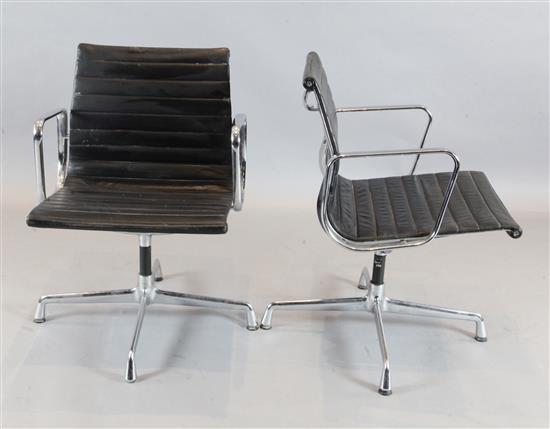 A pair of Charles and Ray Eames revolving desk chairs, W.22in. D.23in. H.2ft 8in.